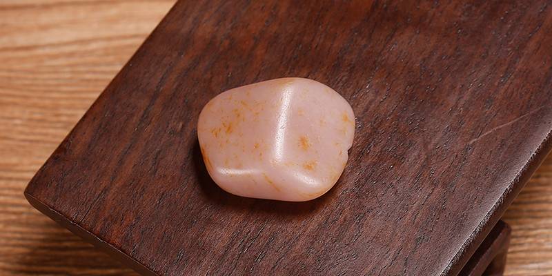 十几年前，花60万买了块粉色的籽料，如今能价值多少？